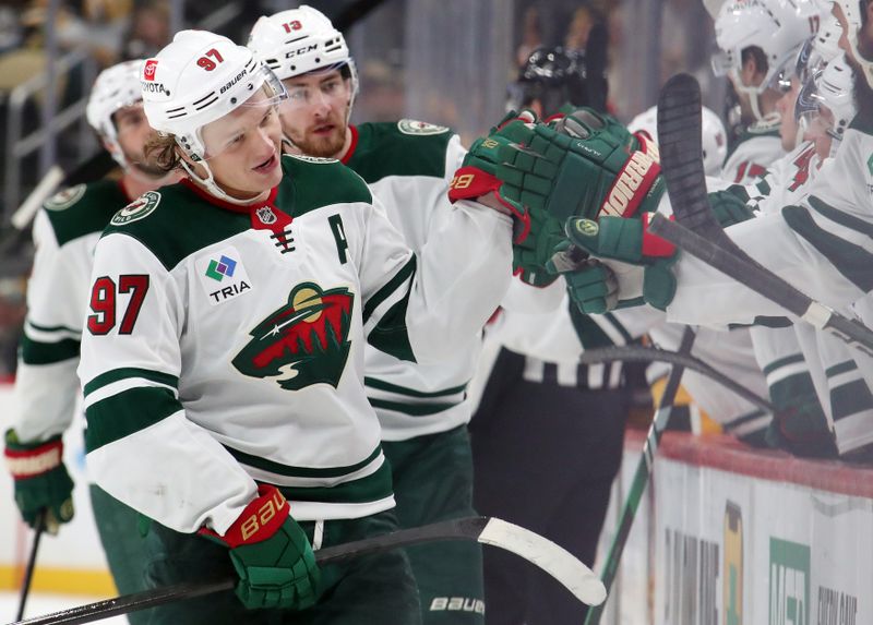 Oct 29, 2024; Pittsburgh, Pennsylvania, USA;  Minnesota Wild left wing Kirill Kaprizov (97) celebrates with the Wild bench after scoring a goal against the Pittsburgh Penguins during the third period at PPG Paints Arena. Mandatory Credit: Charles LeClaire-Imagn Images