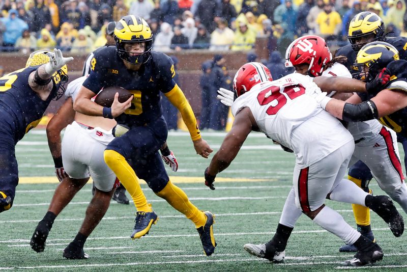 Oct 14, 2023; Ann Arbor, Michigan, USA; Michigan Wolverines quarterback J.J. McCarthy (9) rushes in the second half against the Indiana Hoosiers at Michigan Stadium. Mandatory Credit: Rick Osentoski-USA TODAY Sports