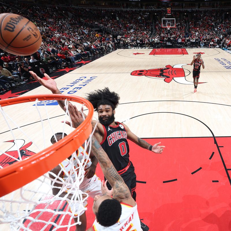 CHICAGO, IL - APRIL 17: Coby White #0 of the Chicago Bulls drives to the basket during the game against the Atlanta Hawks during the 2024 Play-In Tournament  on April 17, 2024 at United Center in Chicago, Illinois. NOTE TO USER: User expressly acknowledges and agrees that, by downloading and or using this photograph, User is consenting to the terms and conditions of the Getty Images License Agreement. Mandatory Copyright Notice: Copyright 2024 NBAE (Photo by Jeff Haynes/NBAE via Getty Images)