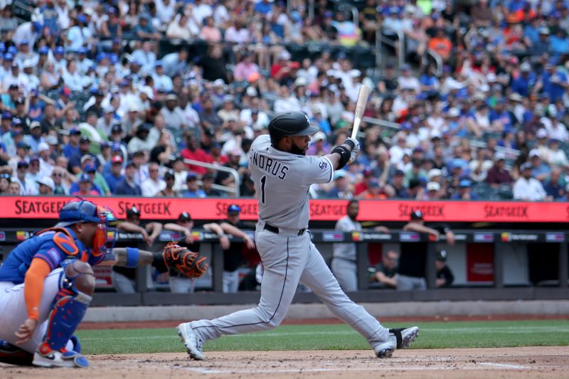 Jul 20, 2023; New York City, New York, USA; Chicago White Sox second baseman Elvis Andrus (1) follows through on an RBI sacrifice fly against the New York Mets during the second inning at Citi Field. Mandatory Credit: Brad Penner-USA TODAY Sports