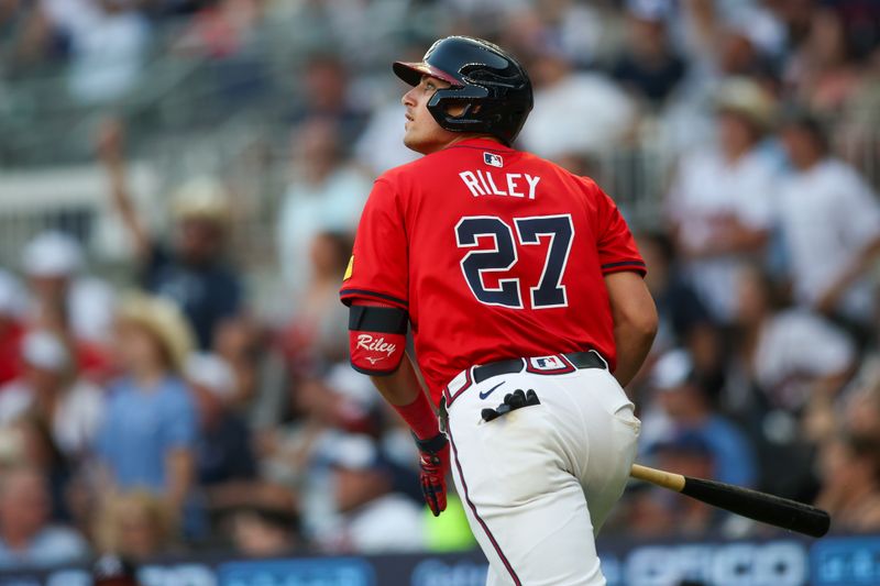 Jun 14, 2024; Atlanta, Georgia, USA; Atlanta Braves third baseman Austin Riley (27) hits a two-run home run against the Tampa Bay Rays in the second inning at Truist Park. Mandatory Credit: Brett Davis-USA TODAY Sports
