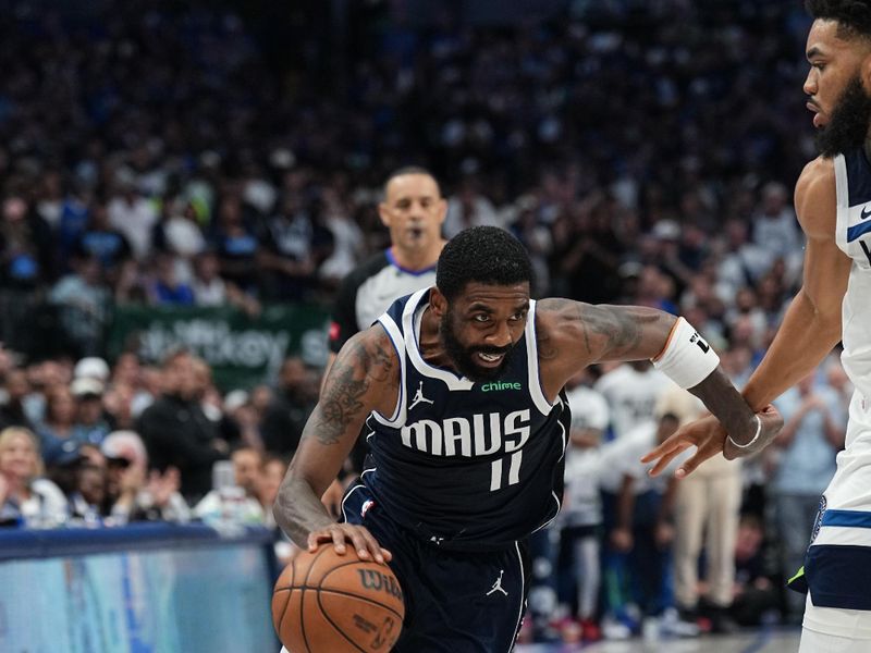 DALLAS, TX - MAY 26: Kyrie Irving #11 of the Dallas Mavericks handles the ball during the game  against the Minnesota Timberwolves during Game 3 of the Western Conference Finals of the 2024 NBA Playoffs on May 26, 2024 at the American Airlines Center in Dallas, Texas. NOTE TO USER: User expressly acknowledges and agrees that, by downloading and or using this photograph, User is consenting to the terms and conditions of the Getty Images License Agreement. Mandatory Copyright Notice: Copyright 2024 NBAE (Photo by Glenn James/NBAE via Getty Images)