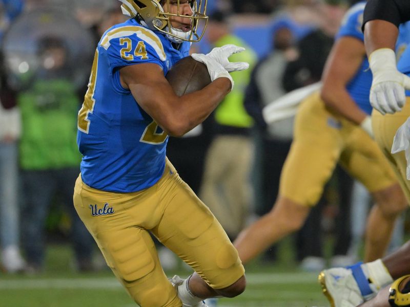 Nov 12, 2022; Pasadena, California, USA; UCLA Bruins running back Zach Charbonnet (24) runs the ball in the first half against the Arizona Wildcats at the Rose Bowl. Mandatory Credit: Jayne Kamin-Oncea-USA TODAY Sports