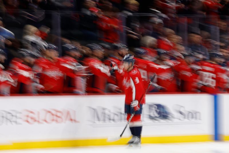 Oct 21, 2025; Washington, District of Columbia, USA; Washington Capitals right wing Ryan Leonard (9) celebrates with teammates after scoring a goal against the Seattle Kraken during the second period at Capital One Arena. Mandatory Credit: Geoff Burke-Imagn Images
