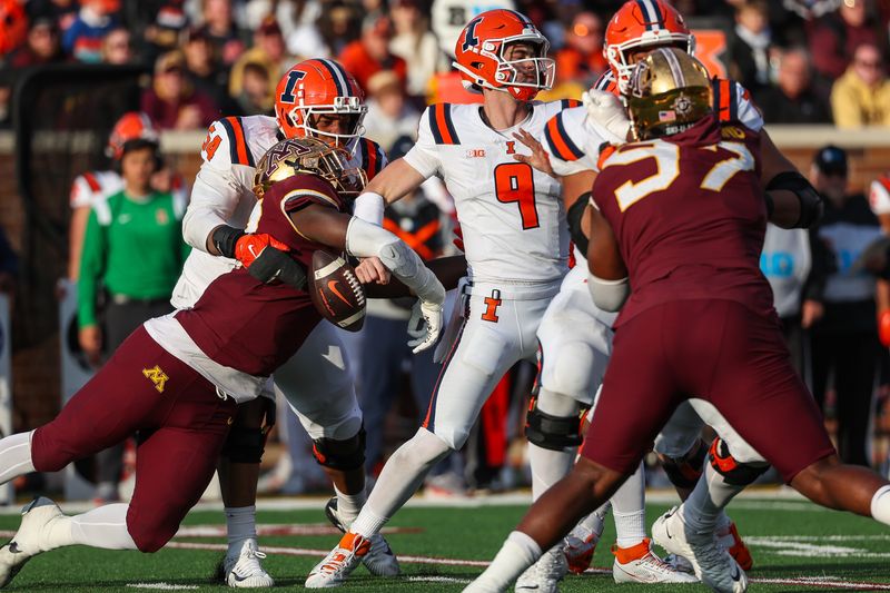 Nov 4, 2023; Minneapolis, Minnesota, USA; Minnesota Golden Gophers defensive lineman Jah Joyner (17) forces a fumble on Illinois Fighting Illini quarterback Luke Altmyer (9) during the second half at Huntington Bank Stadium. Mandatory Credit: Matt Krohn-USA TODAY Sports