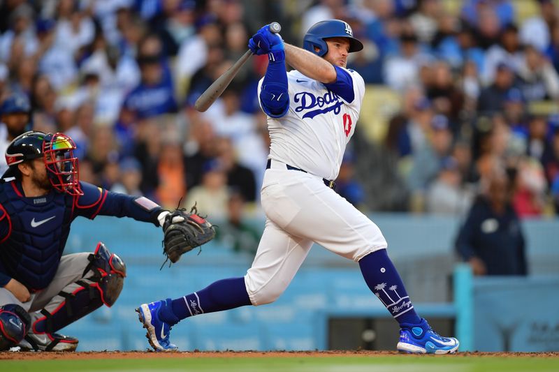 May 4, 2024; Los Angeles, California, USA; Los Angeles Dodgers third baseman Max Muncy (13) hits a single against the Atlanta Braves during the third inning at Dodger Stadium. Mandatory Credit: Gary A. Vasquez-USA TODAY Sports