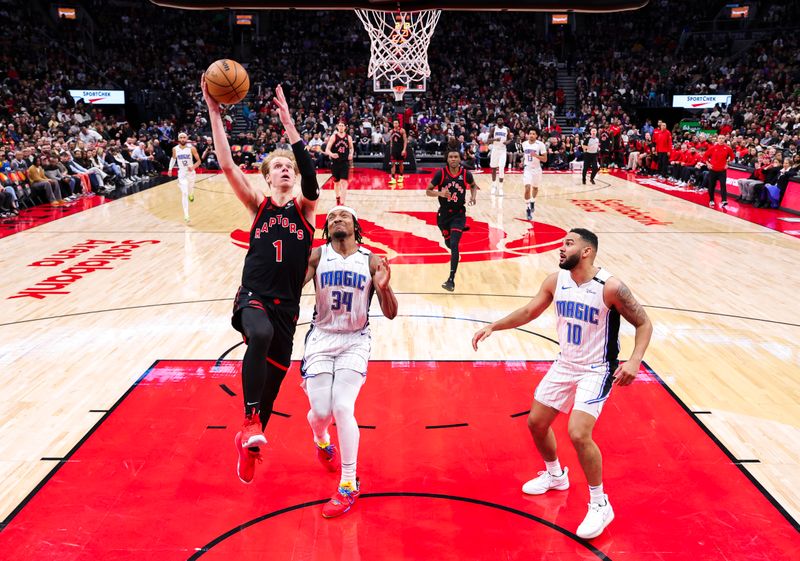 TORONTO, CANADA - JANUARY 3: Gradey Dick #1 of the Toronto Raptors drives to the basket during the game against the Orlando Magic on January 3, 2025 at the Scotiabank Arena in Toronto, Ontario, Canada.  NOTE TO USER: User expressly acknowledges and agrees that, by downloading and or using this Photograph, user is consenting to the terms and conditions of the Getty Images License Agreement.  Mandatory Copyright Notice: Copyright 2025 NBAE (Photo by Vaughn Ridley/NBAE via Getty Images)