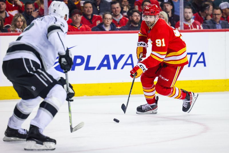 Mar 28, 2023; Calgary, Alberta, CAN; Calgary Flames center Nazem Kadri (91) controls the puck against the Los Angeles Kings during the second period at Scotiabank Saddledome. Mandatory Credit: Sergei Belski-USA TODAY Sports