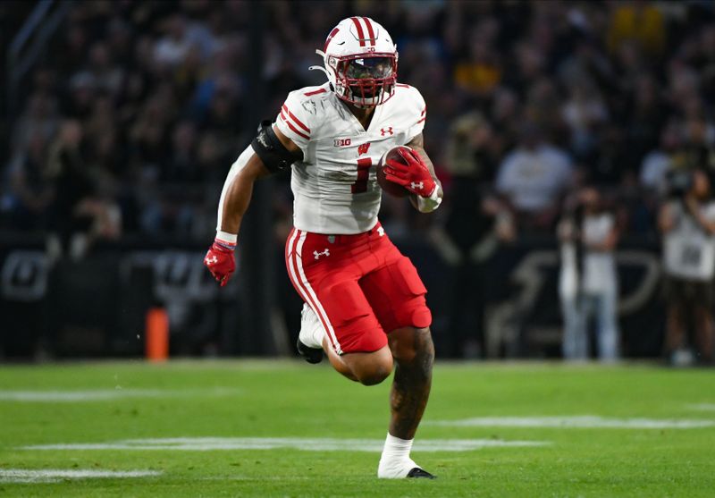 Sep 22, 2023; West Lafayette, Indiana, USA; Wisconsin Badgers running back Chez Mellusi (1) runs the ball during the first half at Ross-Ade Stadium. Mandatory Credit: Robert Goddin-USA TODAY Sports