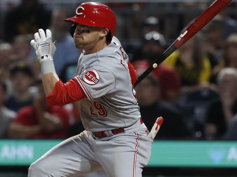 Aug 11, 2023; Pittsburgh, Pennsylvania, USA;  Cincinnati Reds center fielder TJ Friedl (29) hits a RBI single against the Pittsburgh Pirates during the eighth inning at PNC Park. Mandatory Credit: Charles LeClaire-USA TODAY Sports