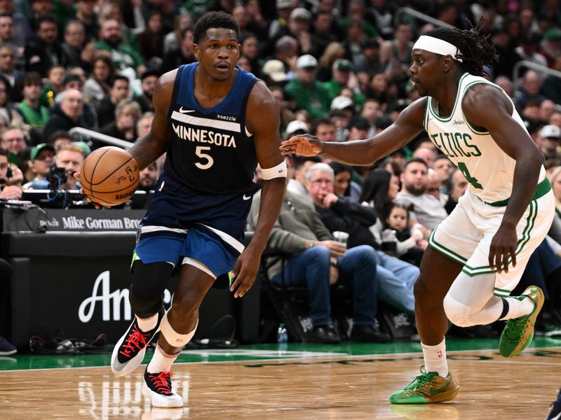 BOSTON, MASSACHUSETTS - NOVEMBER 24: Anthony Edwards #5 of the Minnesota Timberwolves drives to the basket against Jrue Holiday #4 of the Boston Celtics during the fourth quarter at the TD Garden on November 24, 2024 in Boston, Massachusetts. NOTE TO USER: User expressly acknowledges and agrees that, by downloading and or using this photograph, User is consenting to the terms and conditions of the Getty Images License Agreement. (Photo by Brian Fluharty/Getty Images)