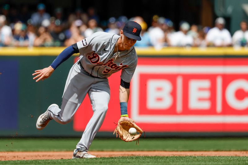 Jul 16, 2023; Seattle, Washington, USA; Detroit Tigers third baseman Nick Maton (9) fields a ground ball against the Seattle Mariners during the third inning at T-Mobile Park. Mandatory Credit: Joe Nicholson-USA TODAY Sports