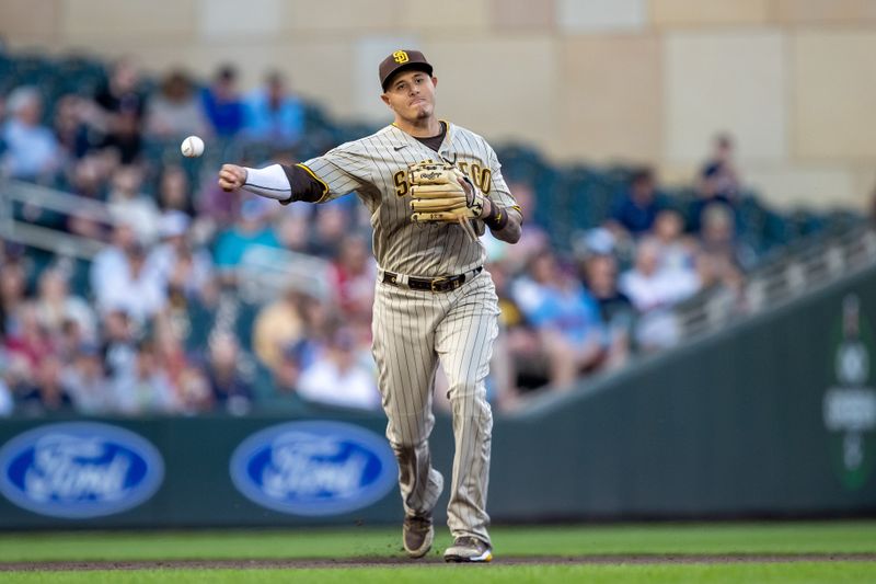 May 10, 2023; Minneapolis, Minnesota, USA; San Diego Padres third baseman Manny Machado (13) throws the ball to first base for an out in the fifth inning against the Minnesota Twins at Target Field. Mandatory Credit: Jesse Johnson-USA TODAY Sports