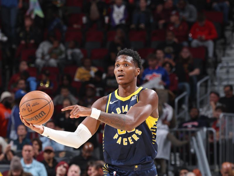 Cleveland, OH - OCTOBER 10: Bennedict Mathurin #00 of the Indiana Pacers looks to pass the ball during the game against the Cleveland Cavaliers during a NBA pre season game on October 10, 2024 at Rocket Mortgage Fieldhouse in Cleveland, Ohio. NOTE TO USER: User expressly acknowledges and agrees that, by downloading and or using this photograph, User is consenting to the terms and conditions of the Getty Images License Agreement. Mandatory Copyright Notice: Copyright 2024 NBAE (Photo by Jeff Haynes/NBAE via Getty Images)