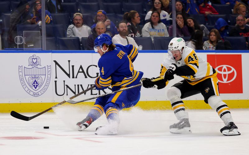 Sep 21, 2024; Buffalo, New York, USA;  Buffalo Sabres defenseman Bowen Byram (4) skates with the puck as Pittsburgh Penguins right wing Valtteri Puustinen (48) defends during the third period at KeyBank Center. Mandatory Credit: Timothy T. Ludwig-Imagn Images
