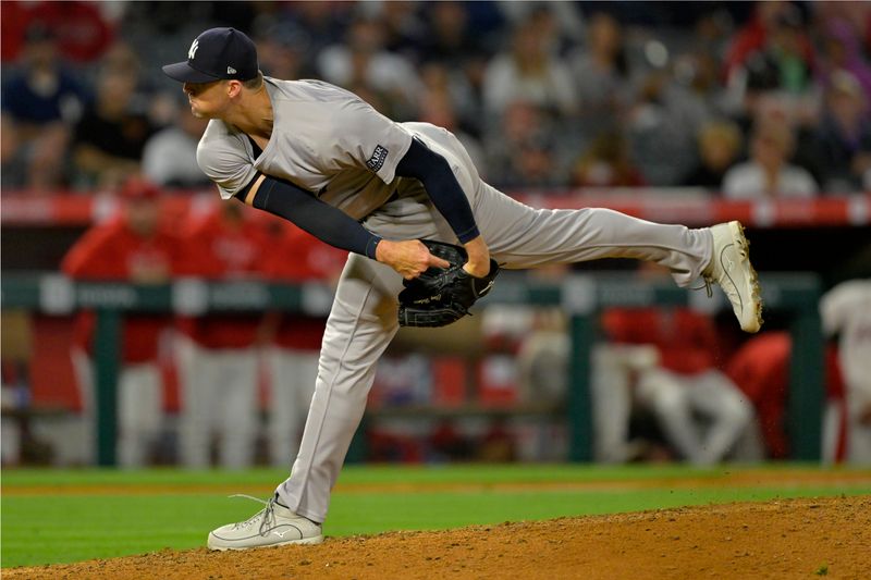 May 29, 2024; Anaheim, California, USA;  New York Yankees relief pitcher Clay Holmes (35) throws to the plate in the ninth inning against the Los Angeles Angels at Angel Stadium. Mandatory Credit: Jayne Kamin-Oncea-USA TODAY Sports