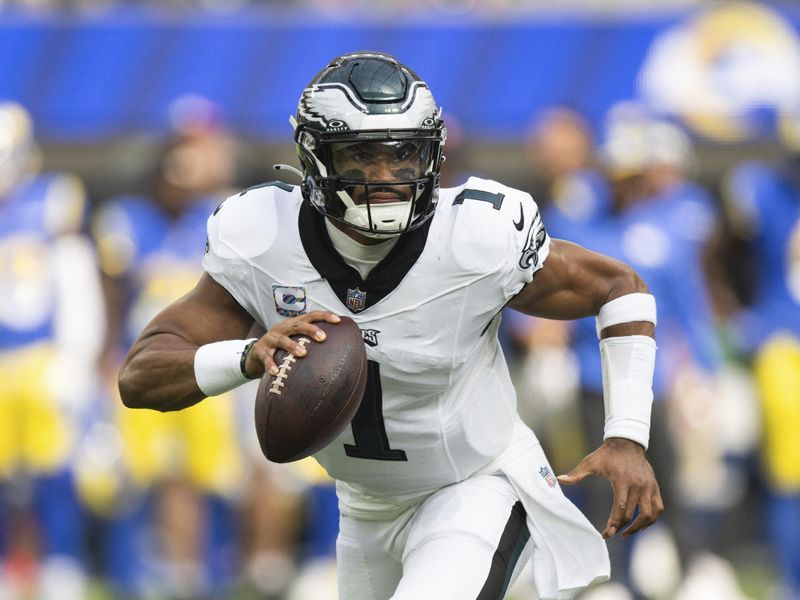 Philadelphia Eagles quarterback Jalen Hurts (1) runs with the ball during an NFL football game against the Los Angeles Rams, Sunday, Oct. 8, 2023, in Inglewood, Calif. (AP Photo/Kyusung Gong)