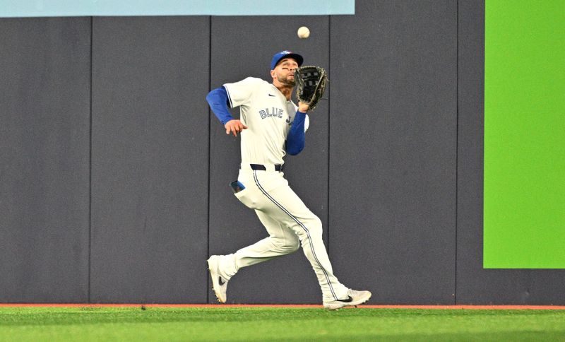 Apr 10, 2024; Toronto, Ontario, CAN;  Toronto Blue Jays center fielder Kevin Kiermaier (39) catches a fly ball hit by Seattle Mariners shortstop J.P. Crawford (not shown) in the fifth inning at Rogers Centre. Mandatory Credit: Dan Hamilton-USA TODAY Sports