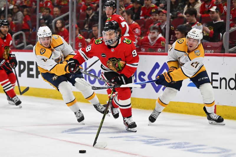 Apr 12, 2024; Chicago, Illinois, USA; Nashville Predators forward Cody Glass (8) and Nashville Predators forward Anthony Beauvillier (21) team up to defend against Chicago Blackhawks forward Connor Bedard (98) in the third period at United Center. Mandatory Credit: Jamie Sabau-USA TODAY Sports