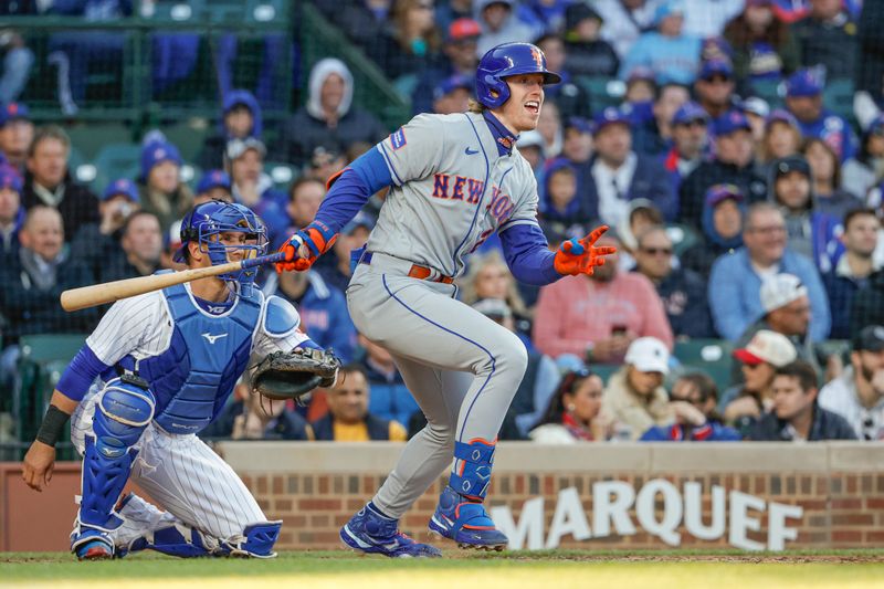 May 25, 2023; Chicago, Illinois, USA; New York Mets third baseman Brett Baty (22) hits an RBI single against the Chicago Cubs during the third inning at Wrigley Field. Mandatory Credit: Kamil Krzaczynski-USA TODAY Sports