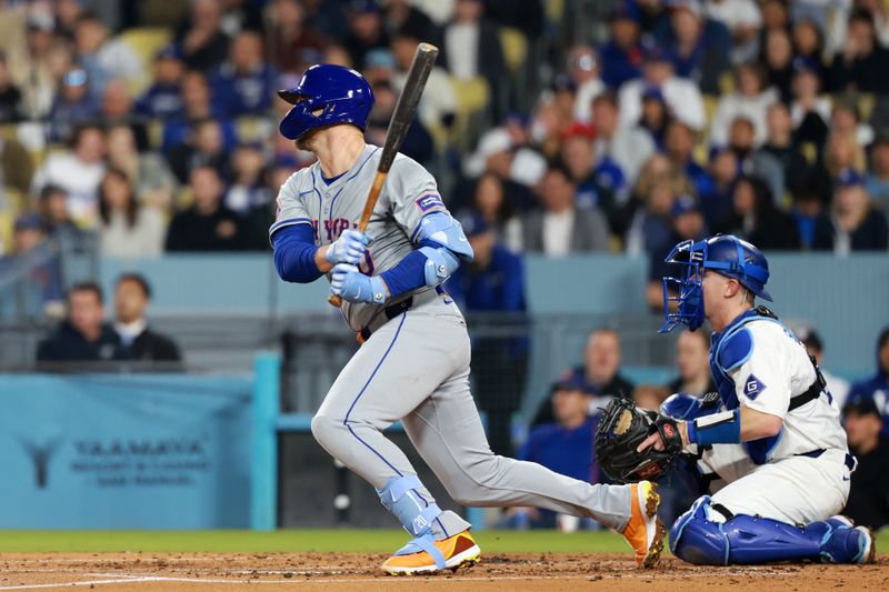 Apr 19, 2024; Los Angeles, California, USA;  New York Mets first base Pete Alonso (20) hits an RBI single during the third inning against the Los Angeles Dodgers at Dodger Stadium. Mandatory Credit: Kiyoshi Mio-USA TODAY Sports