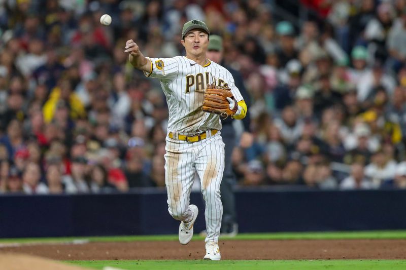 May 20, 2023; San Diego, California, USA;  San Diego Padres third baseman Ha-Seong Kim (7) throws to first base to record the out in the sixth inning against the San Diego Padres at Petco Park. Mandatory Credit: David Frerker-USA TODAY Sports