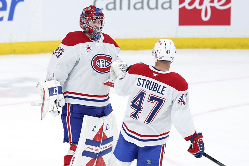Feb 4, 2026; Winnipeg, Manitoba, CAN; Montreal Canadiens goaltender Samuel Montembeault (35) and defenseman Jayden Struble (47) celebrate a victory against the Winnipeg Jets at Canada Life Centre. Mandatory Credit: James Carey Lauder-Imagn Images