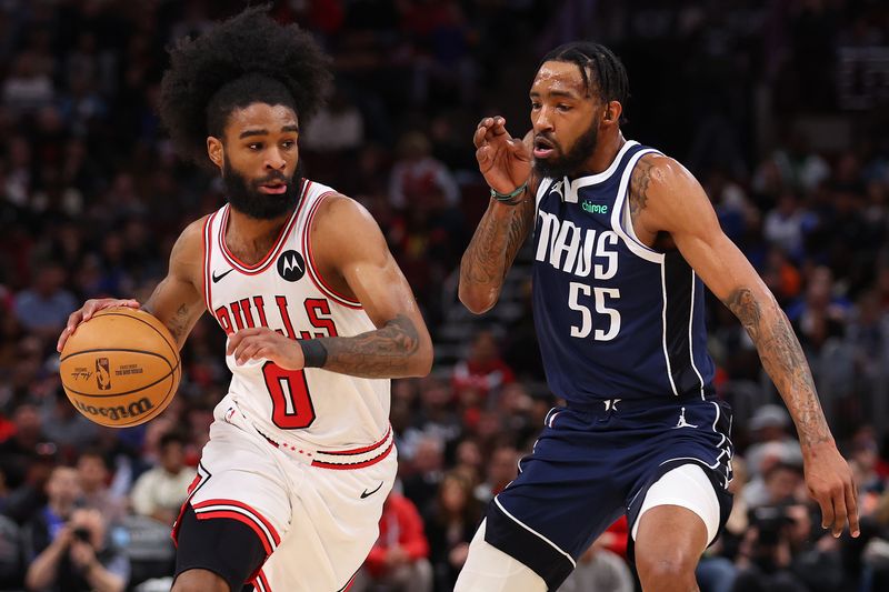 CHICAGO, ILLINOIS - MARCH 11: Coby White #0 of the Chicago Bulls drives to the basket against Derrick Jones Jr. #55 of the Dallas Mavericks during the second half at the United Center on March 11, 2024 in Chicago, Illinois. NOTE TO USER: User expressly acknowledges and agrees that, by downloading and or using this photograph, User is consenting to the terms and conditions of the Getty Images License Agreement.  (Photo by Michael Reaves/Getty Images)