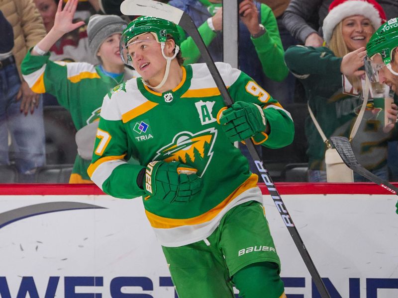 Dec 23, 2023; Saint Paul, Minnesota, USA; Minnesota Wild left wing Kirill Kaprizov (97) celebrates his goal against the Boston Bruins in the second period at Xcel Energy Center. Mandatory Credit: Brad Rempel-USA TODAY Sports