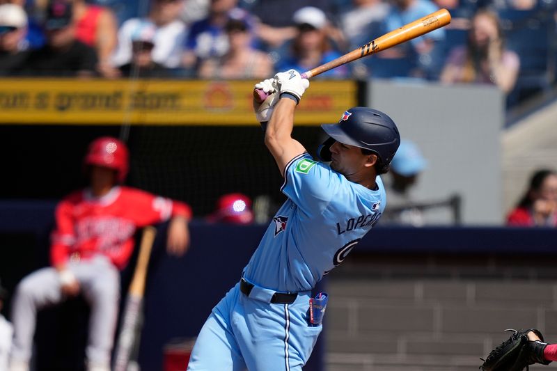 Aug 24, 2024; Toronto, Ontario, CAN; Toronto Blue Jays left fielder Joey Loperfido (9) hits an RBI against the Los Angeles Angels during the  first inning at Rogers Centre. Mandatory Credit: John E. Sokolowski-USA TODAY Sports