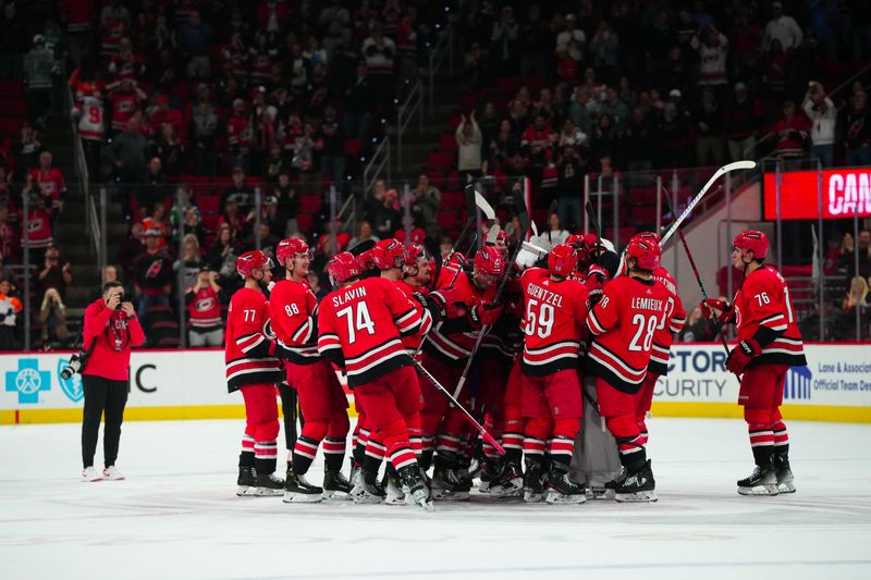 Mar 21, 2024; Raleigh, North Carolina, USA; Carolina Hurricanes players celebrate their victory against the Philadelphia Flyers at PNC Arena. Mandatory Credit: James Guillory-USA TODAY Sports