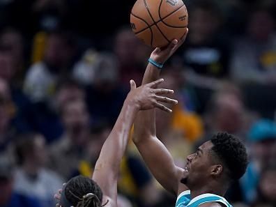 INDIANAPOLIS, INDIANA - DECEMBER 20: Brandon Miller #24 of the Charlotte Hornets attempts a shot while being guarded by Myles Turner #33 of the Indiana Pacers in the first quarter at Gainbridge Fieldhouse on December 20, 2023 in Indianapolis, Indiana. NOTE TO USER: User expressly acknowledges and agrees that, by downloading and or using this photograph, User is consenting to the terms and conditions of the Getty Images License Agreement. (Photo by Dylan Buell/Getty Images)