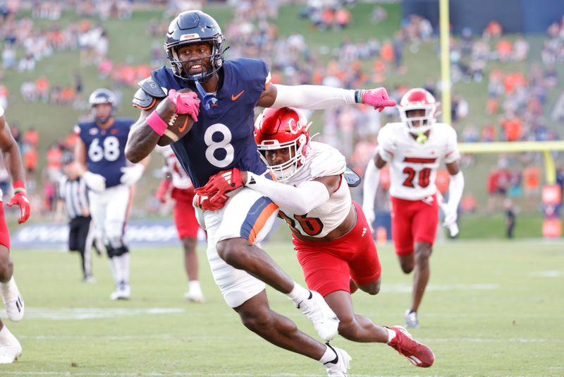 Oct 12, 2024; Charlottesville, Virginia, USA; Virginia Cavaliers wide receiver Malachi Fields (8) carries the ball as Louisville Cardinals defensive back M.J. Griffin (26) defends during the second half at Scott Stadium. Mandatory Credit: Amber Searls-Imagn Images