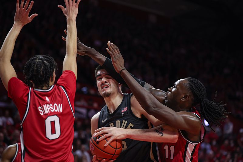 Jan 28, 2024; Piscataway, New Jersey, USA; Purdue Boilermakers center Zach Edey (15) drives to the basket against Rutgers Scarlet Knights center Clifford Omoruyi (11) and guard Derek Simpson (0) during the first half at Jersey Mike's Arena. Mandatory Credit: Vincent Carchietta-USA TODAY Sports