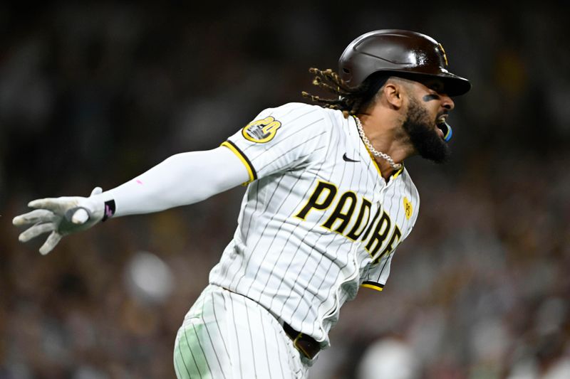 Sep 4, 2024; San Diego, California, USA; San Diego Padres right fielder Fernando Tatis Jr. (23) celebrates after hitting a walk-off single during the tenth inning against the Detroit Tigers at Petco Park. Mandatory Credit: Denis Poroy-Imagn Images