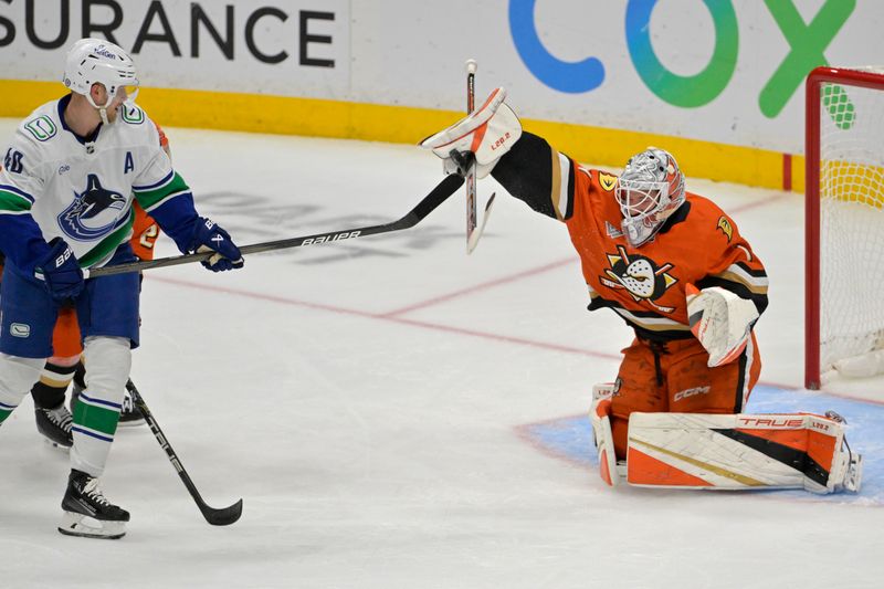 Nov 5, 2024; Anaheim, California, USA; Anaheim Ducks goaltender Lukas Dostal (1) makes a save off a shot by Vancouver Canucks center Elias Pettersson (40) in the second period at Honda Center. Mandatory Credit: Jayne Kamin-Oncea-Imagn Images