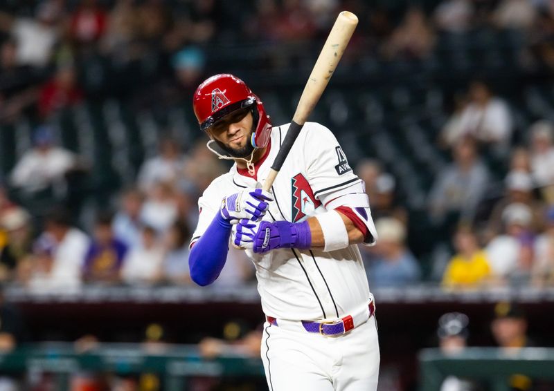 May 27, 2025; Phoenix, Arizona, USA; Arizona Diamondbacks outfielder Lourdes Gurriel Jr. is hit by a pitch in the first inning against the Pittsburgh Pirates at Chase Field. Mandatory Credit: Mark J. Rebilas-Imagn Images