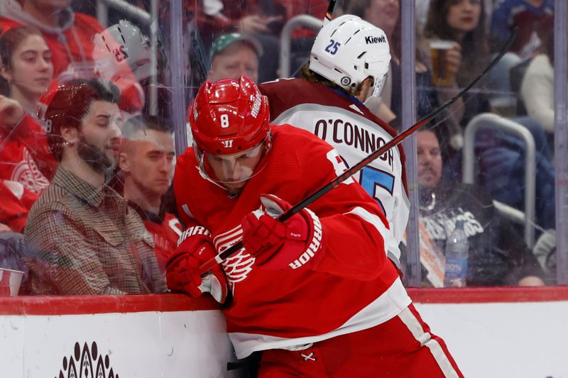 Feb 22, 2024; Detroit, Michigan, USA;  Detroit Red Wings defenseman Ben Chiarot (8) checks Colorado Avalanche right wing Logan O   Connor (25) in the first period at Little Caesars Arena. Mandatory Credit: Rick Osentoski-USA TODAY Sports