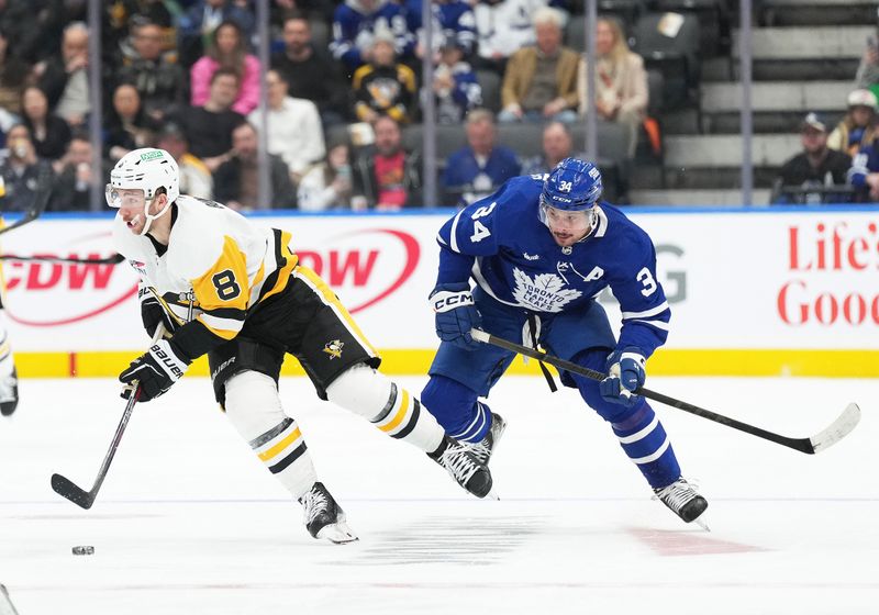 Apr 8, 2024; Toronto, Ontario, CAN; Pittsburgh Penguins left wing Michael Bunting (8) skates with the puck as Toronto Maple Leafs center Auston Matthews (34) tries to defend during the second period at Scotiabank Arena. Mandatory Credit: Nick Turchiaro-USA TODAY Sports