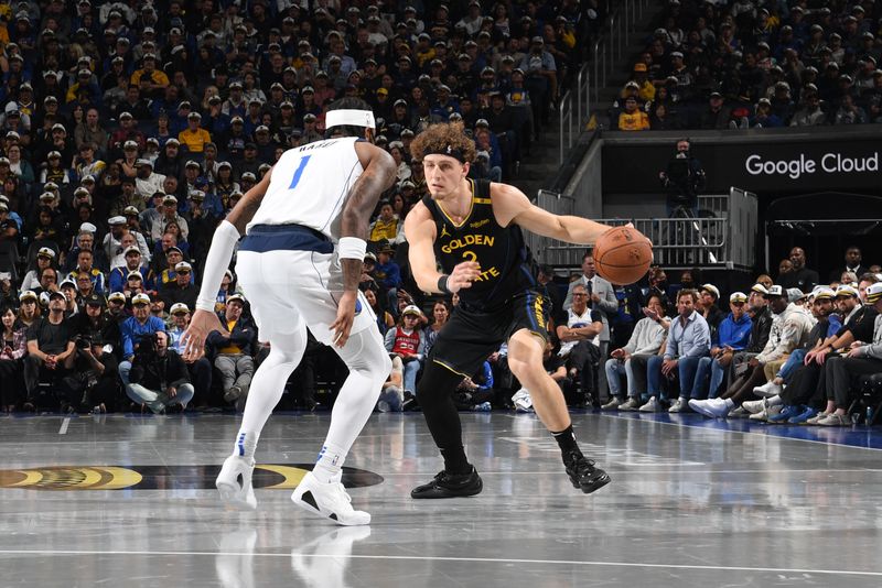 SAN FRANCISCO, CA - NOVEMBER 12: Brandin Podziemski #2 of the Golden State Warriors drives to the basket during the game against the Dallas Mavericks during the Emirates NBA Cup game on November 12, 2024 at Chase Center in San Francisco, California. NOTE TO USER: User expressly acknowledges and agrees that, by downloading and or using this photograph, user is consenting to the terms and conditions of Getty Images License Agreement. Mandatory Copyright Notice: Copyright 2024 NBAE (Photo by Noah Graham/NBAE via Getty Images)