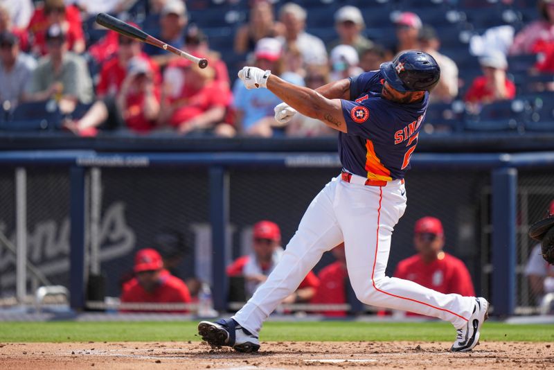 Mar 5, 2025; West Palm Beach, Florida, USA; Houston Astros first base Jon Singleton (28) loses his bat against the St. Louis Cardinals during the second inning at CACTI Park of the Palm Beaches. Mandatory Credit: Rich Storry-Imagn Images