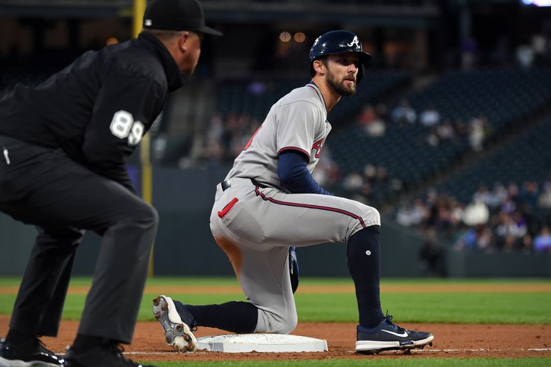 Apr 29, 2025; Denver, Colorado, USA; Atlanta Braves outfielder Eli White (36) slides into third after a triple during the sixth inning against the Colorado Rockies at Coors Field. Mandatory Credit: Christopher Hanewinckel-Imagn Images