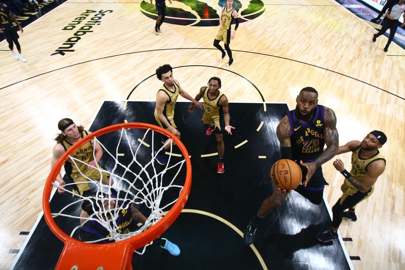 TORONTO, CANADA - APRIL 2: LeBron James #23 of the Los Angeles Lakers drives to the basket during the game against the Toronto Raptors on April 2, 2024 at the Scotiabank Arena in Toronto, Ontario, Canada.  NOTE TO USER: User expressly acknowledges and agrees that, by downloading and or using this Photograph, user is consenting to the terms and conditions of the Getty Images License Agreement.  Mandatory Copyright Notice: Copyright 2023 NBAE (Photo by Vaughn Ridley/NBAE via Getty Images)