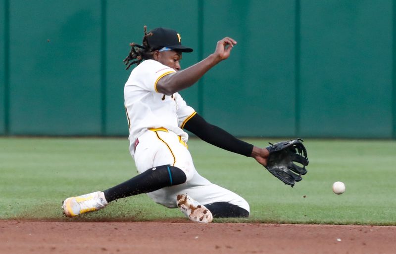 Jul 2, 2024; Pittsburgh, Pennsylvania, USA;  Pittsburgh Pirates shortstop Oneil Cruz (15) can not field a ball hit for a single by St. Louis Cardinals second baseman Nolan Gorman (not pictured) during the sixth inning at PNC Park. Mandatory Credit: Charles LeClaire-USA TODAY Sports