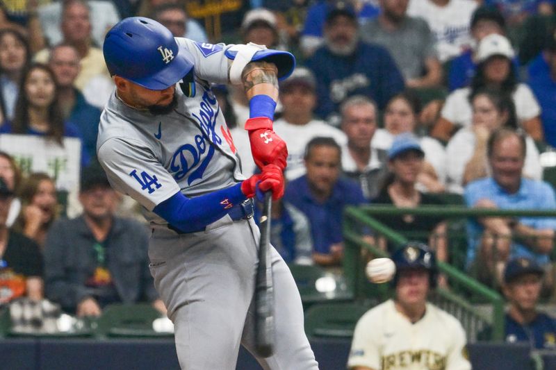 Aug 15, 2024; Milwaukee, Wisconsin, USA; Los Angeles Dodgers center fielder Andy Pages (44) hits a double to drive in a run in the second inning against the Milwaukee Brewers at American Family Field. Mandatory Credit: Benny Sieu-USA TODAY Sports