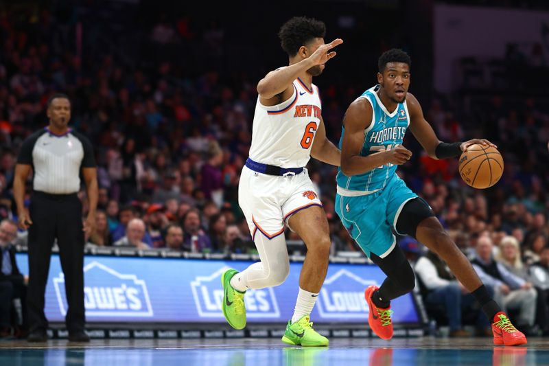 CHARLOTTE, NORTH CAROLINA - JANUARY 29: Brandon Miller #24 of the Charlotte Hornets drives to the basket against Quentin Grimes #6 of the New York Knicks during the first half of the game at Spectrum Center on January 29, 2024 in Charlotte, North Carolina. NOTE TO USER: User expressly acknowledges and agrees that, by downloading and or using this photograph, User is consenting to the terms and conditions of the Getty Images License Agreement. (Photo by Jared C. Tilton/Getty Images)