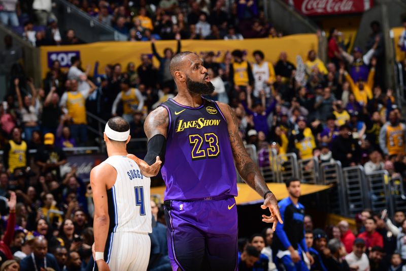 LOS ANGELES, CA - NOVEMBER 21: LeBron James #23 of the Los Angeles Lakers celebrates during the game against the Orlando Magic on November 21, 2024 at Crypto.Com Arena in Los Angeles, California. NOTE TO USER: User expressly acknowledges and agrees that, by downloading and/or using this Photograph, user is consenting to the terms and conditions of the Getty Images License Agreement. Mandatory Copyright Notice: Copyright 2024 NBAE (Photo by Adam Pantozzi/NBAE via Getty Images)