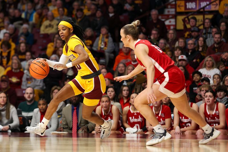 Jan 14, 2024; Minneapolis, Minnesota, USA; Minnesota Golden Gophers guard Janay Sanders (30) works around Nebraska Cornhuskers guard Callin Hake (14) during the first half at Williams Arena. Mandatory Credit: Matt Krohn-USA TODAY Sports