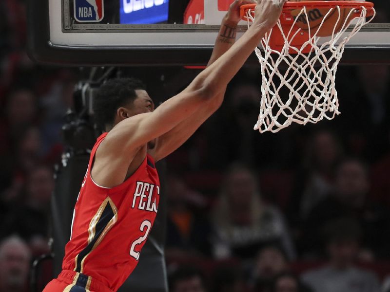 PORTLAND, OREGON - MARCH 27: Trey Murphy III #25 of the New Orleans Pelicans dunks against the Portland Trail Blazers during the fourth quarter at Moda Center on March 27, 2023 in Portland, Oregon. NOTE TO USER: User expressly acknowledges and agrees that, by downloading and or using this photograph, user is consenting to the terms and conditions of the Getty Images License Agreement. (Photo by Amanda Loman/Getty Images)