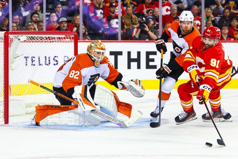 Oct 12, 2024; Calgary, Alberta, CAN; Philadelphia Flyers goaltender Ivan Fedotov (82) guards his net against Calgary Flames center Nazem Kadri (91) during the second period at Scotiabank Saddledome. Mandatory Credit: Sergei Belski-Imagn Images